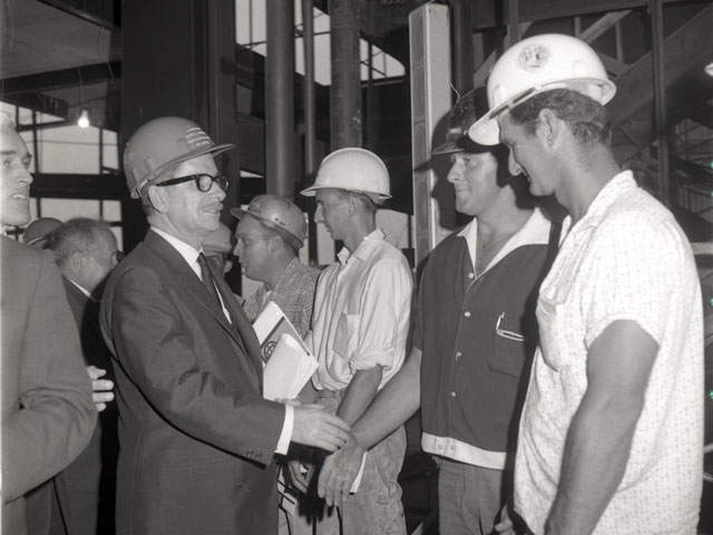 Tour by Premier Daniel Johnson of the construction site of the Quebec Pavilion at the Montréal World Fair located on Ile Sainte-Hélène in 1966